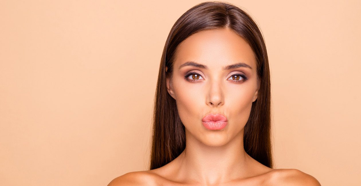 woman-puckering-lips-after-successful-lip-injections