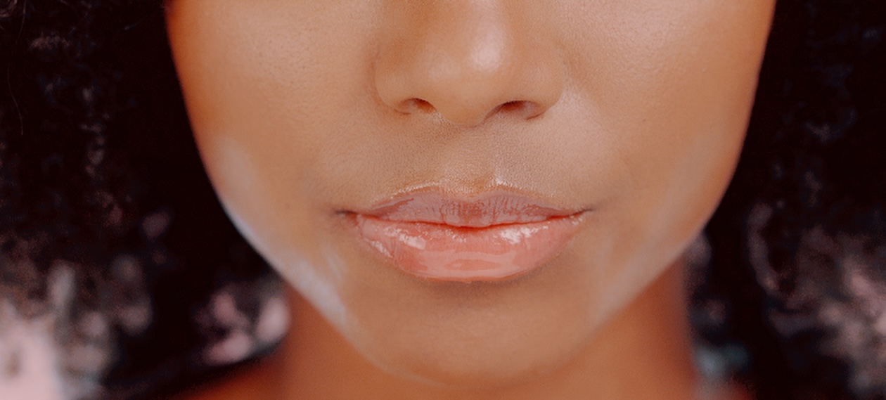 close up of woman with glossy full lips