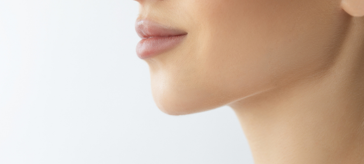 close-up profile of a woman's lips, chin and jawline